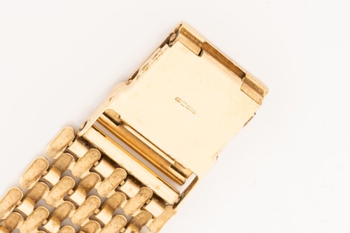 Lot 445 - A 9ct gold Sovereign wristwatch, the gilt dial...
