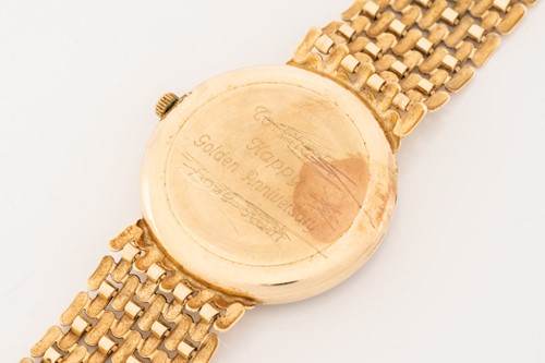 Lot 445 - A 9ct gold Sovereign wristwatch, the gilt dial...