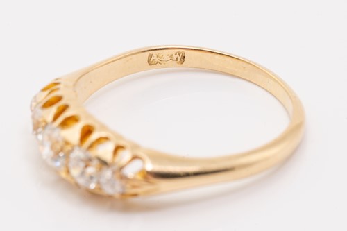 Lot 7 - A five-stone diamond half-hoop ring,...