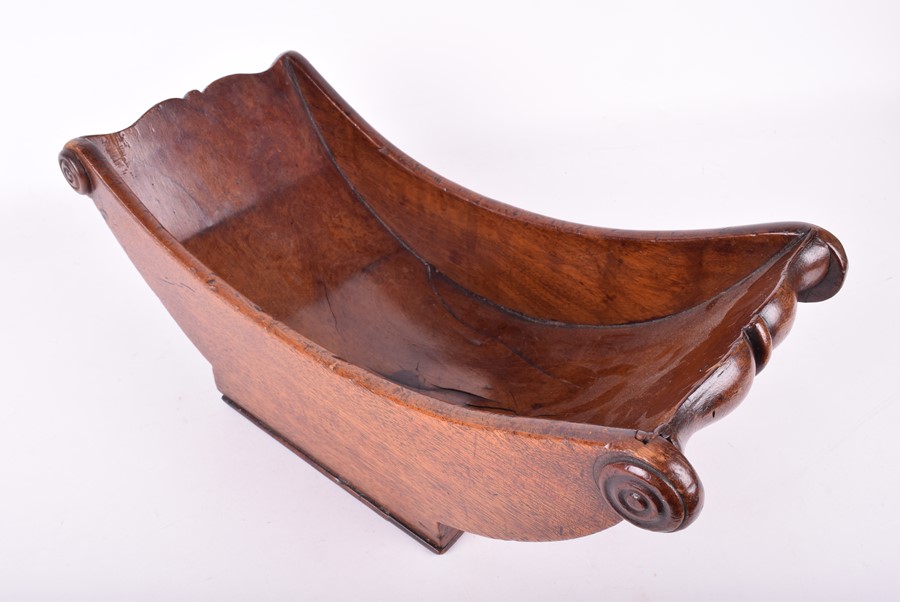 Lot 270 A Georgian mahogany cheese coaster of curved