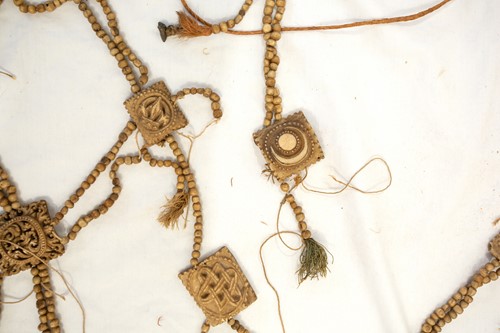 Lot 89 - A Tibetan carved bone necromancer's apron,...