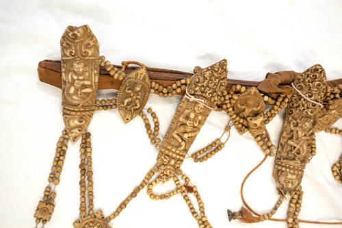 Lot 89 - A Tibetan carved bone necromancer's apron,...