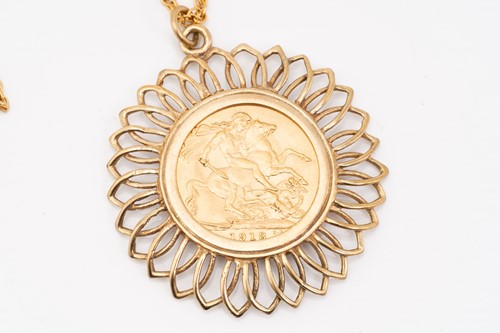 Lot 34 - A sovereign pendant on chain; the sovereign...