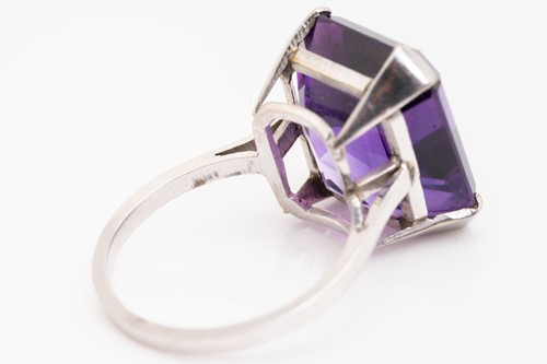 Lot 38 - An amethyst solitaire ring, featuring an...