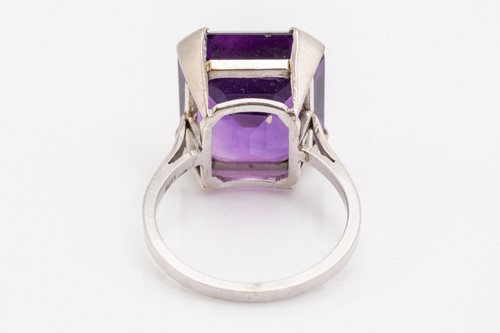 Lot 38 - An amethyst solitaire ring, featuring an...