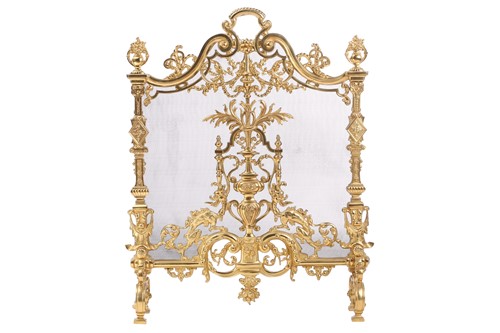 Lot 173 - A Louis XVI-style heavy ormolu spark guard,...