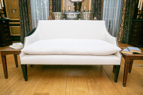 Lot 104 - A George III style two-seat sofa with swept...