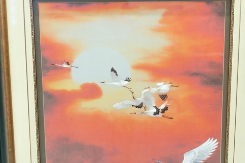 Lot 84 - A large Japanese embroidered picture of cranes...