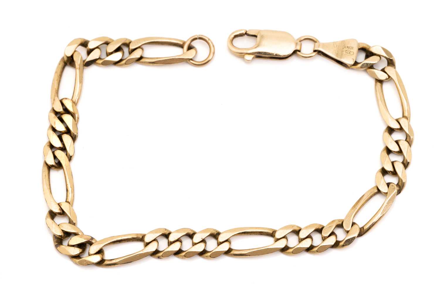 Lot 84 - A flat Figaro link bracelet in 9ct yellow gold,...