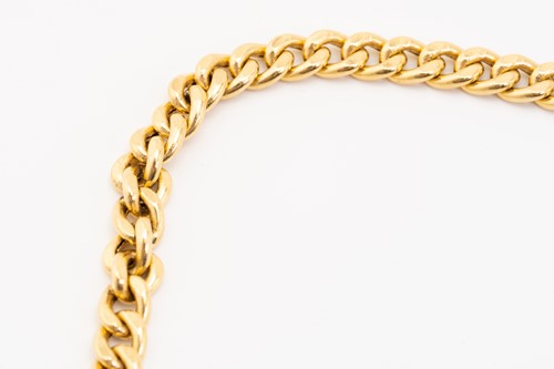 Lot 121 - A yellow metal flat curb link chain, fastens...