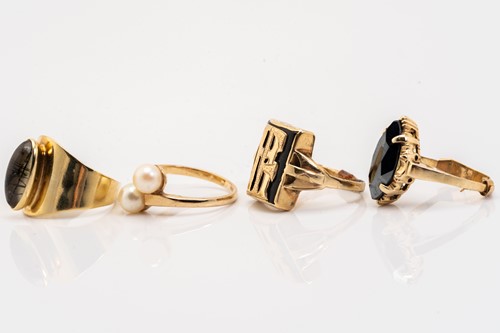 Lot 36 - Four gem-set rings; including a pearl...