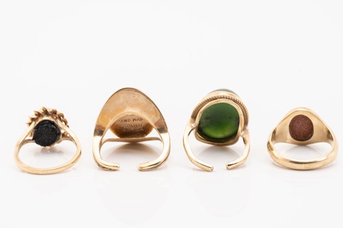 Lot 115 - Four hard stone rings; including a 9ct yellow...