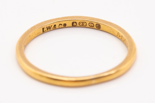 Lot 175 - Four gold rings and a platinum ring; including...