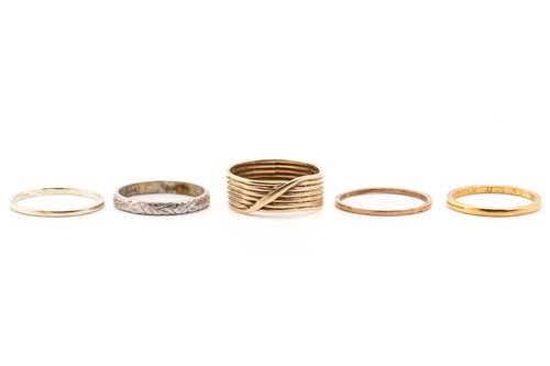 Lot 175 - Four gold rings and a platinum ring; including...
