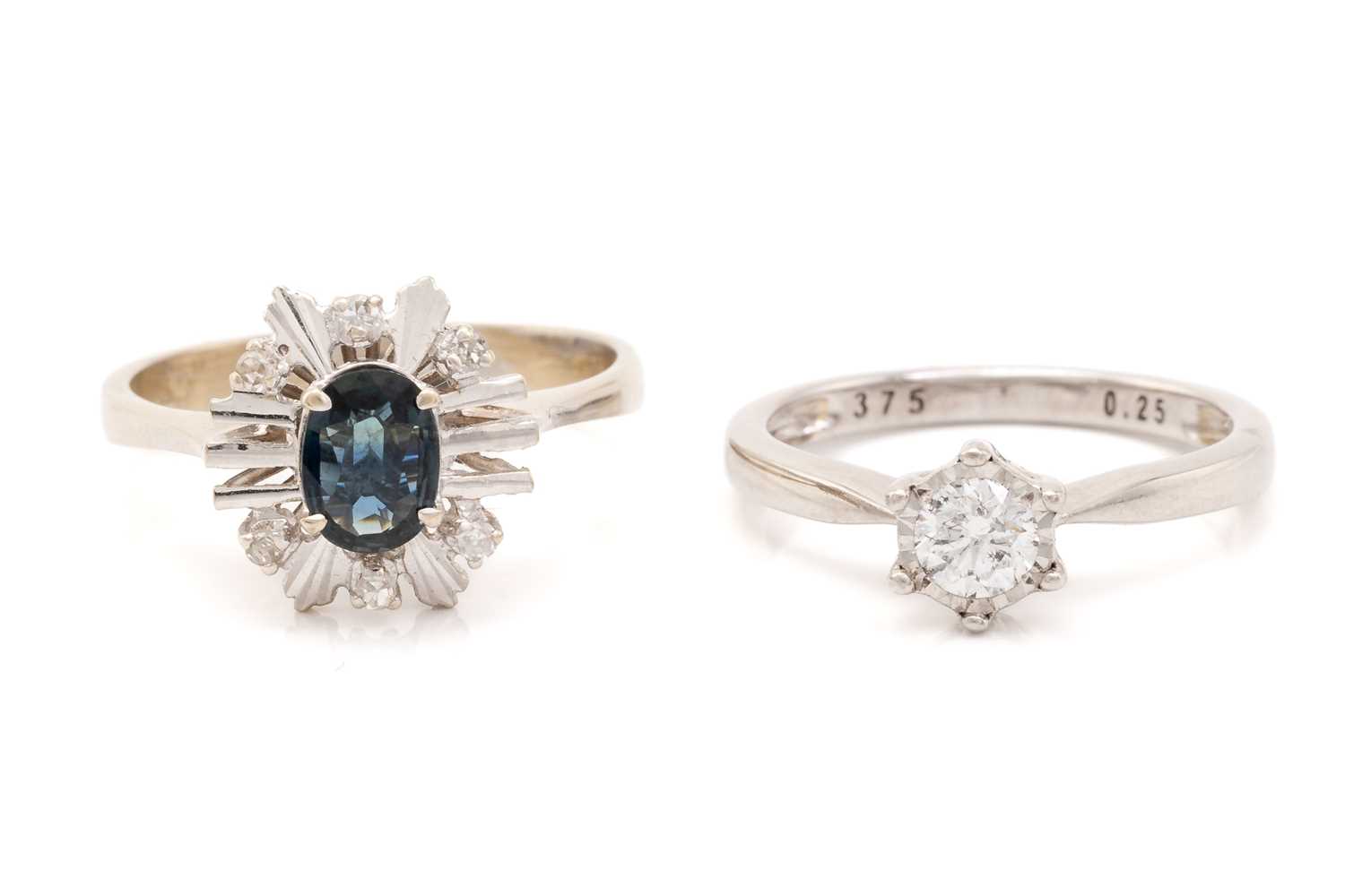 Lot 186 - A diamond solitaire ring and a sapphire dress...