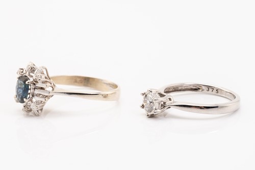 Lot 186 - A diamond solitaire ring and a sapphire dress...