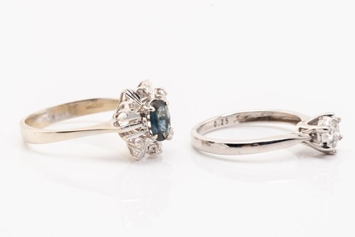 Lot 186 - A diamond solitaire ring and a sapphire dress...