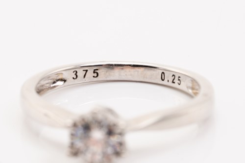 Lot 186 - A diamond solitaire ring and a sapphire dress...