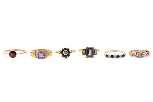 Lot 23 - A 9ct yellow gold and amethyst dress ring,...