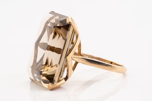 Lot 192 - A large smoky quartz cocktail ring and a...