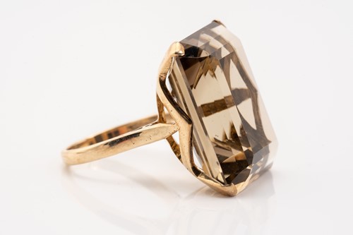 Lot 192 - A large smoky quartz cocktail ring and a...