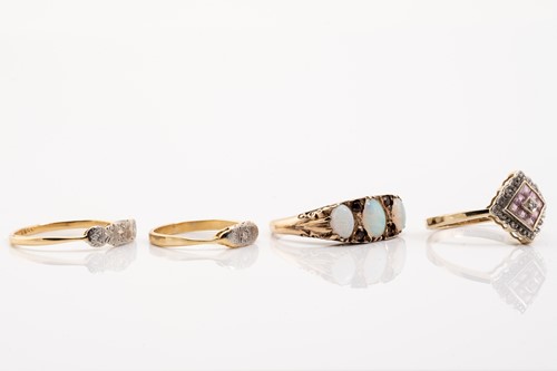 Lot 10 - Four gem-set dress rings, including an...