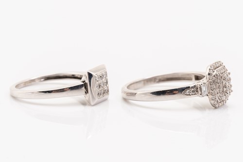 Lot 136 - Two diamond set cluster rings in white metal,...