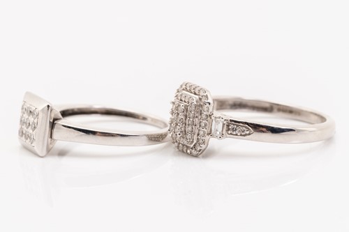 Lot 136 - Two diamond set cluster rings in white metal,...