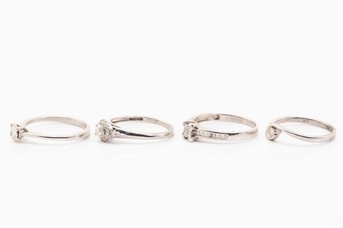 Lot 223 - Four diamond set rings, featuring illusion and...