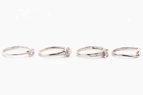 Lot 223 - Four diamond set rings, featuring illusion and...