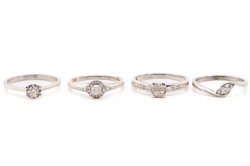 Lot 223 - Four diamond set rings, featuring illusion and...
