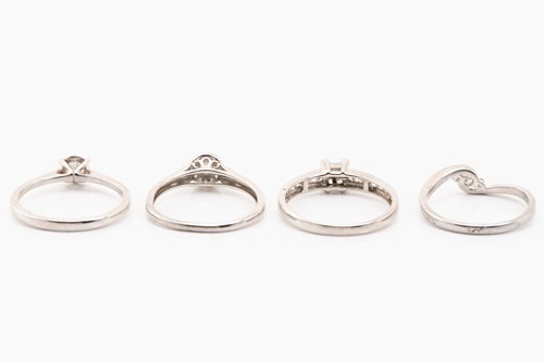 Lot 223 - Four diamond set rings, featuring illusion and...