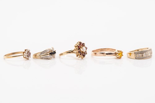Lot 135 - Five gold rings; including a yellow metal and...