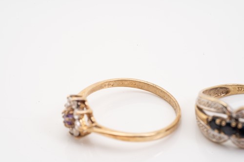 Lot 135 - Five gold rings; including a yellow metal and...