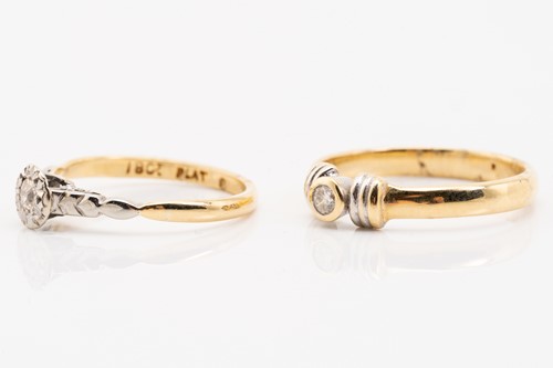 Lot 225 - Two diamond solitaire rings; consisting of an...
