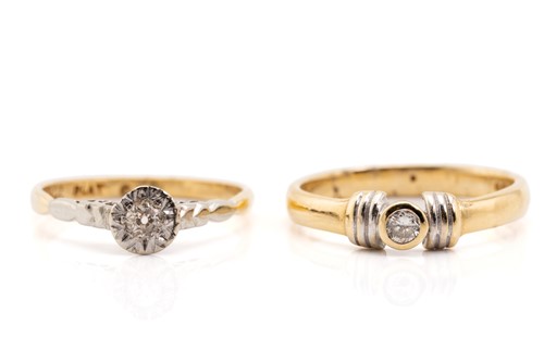 Lot 225 - Two diamond solitaire rings; consisting of an...