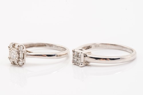 Lot 168 - Two diamond cluster rings in white gold; the...