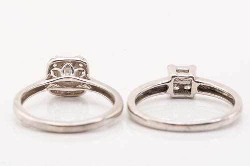 Lot 168 - Two diamond cluster rings in white gold; the...