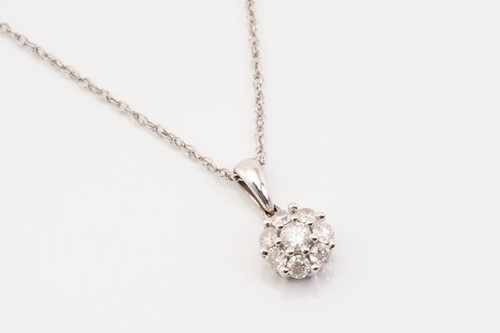 Lot 202 - A diamond set cluster pendant and chain,...