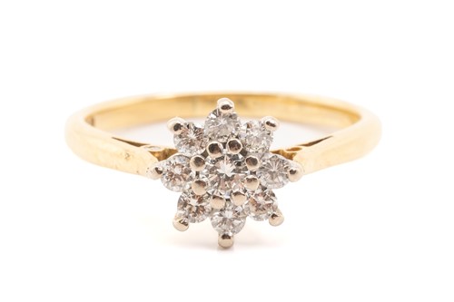 Lot 230 - A diamond set cluster ring, featuring nine...