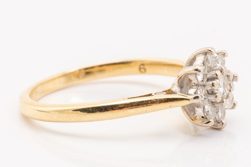 Lot 230 - A diamond set cluster ring, featuring nine...