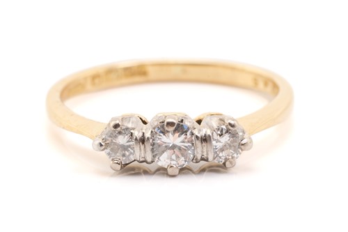 Lot 157 - A yellow gold and diamond three stone half...