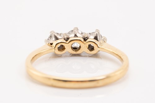 Lot 157 - A yellow gold and diamond three stone half...