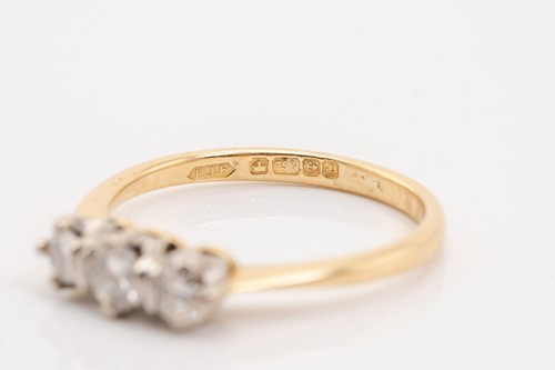 Lot 157 - A yellow gold and diamond three stone half...