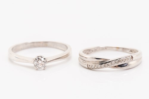 Lot 83 - A diamond solitaire ring and a diamond-set...