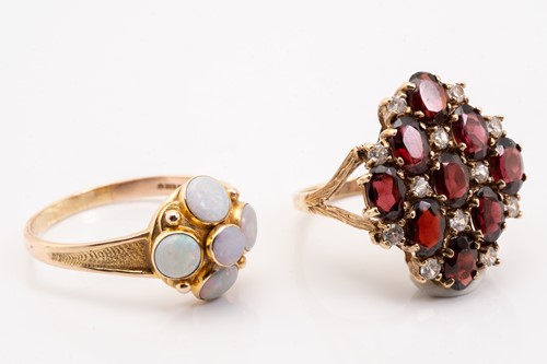 Lot 62 - Two 9ct gold gem-set rings and a jug charm;...