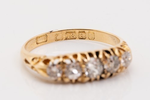 Lot 176 - An Edwardian half hoop five-stone diamond ring,...