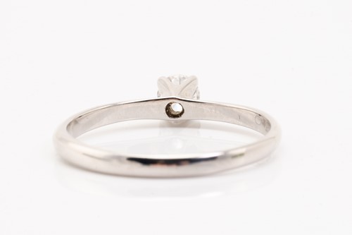 Lot 96 - A diamond solitaire ring in 18ct white gold,...