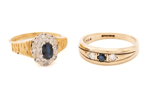 Lot 129 - A sapphire and diamond cluster rings, the oval...