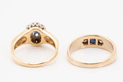 Lot 129 - A sapphire and diamond cluster rings, the oval...